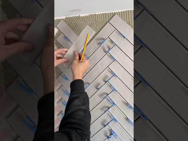 Cutting herringbone tile pattern