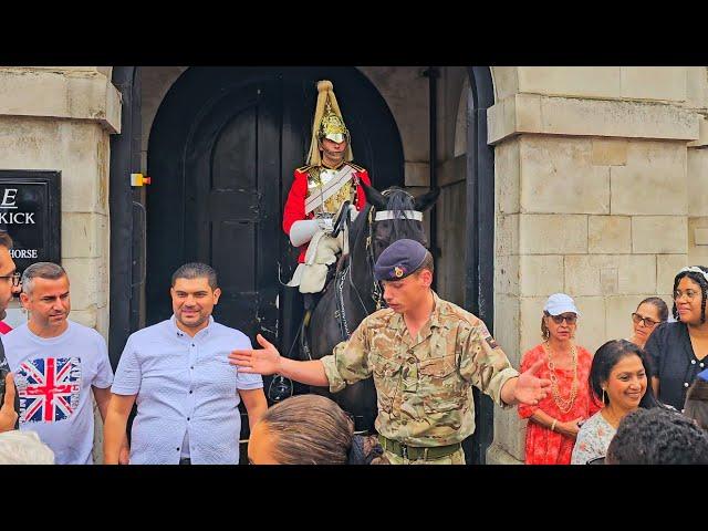 SOLDIER TELLS SMIRKING IDIOTS TO GET BACK AND GIVE THE HORSE SOME SPACE at Horse Guards!