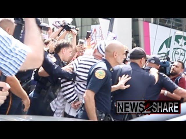 Anti-Trump protester arrested after jumping in front of motorcade exiting Miami Trump arraignment