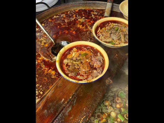 Eating beef noodles in Hubei Xiangyang  15 yuan per bowl  with red oil and very spicy. It would be