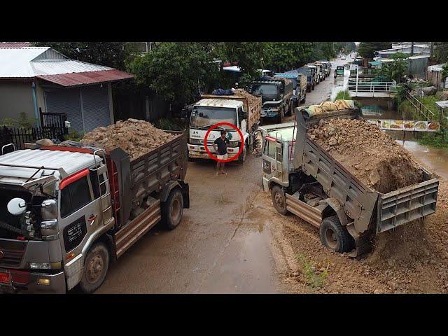 Perfectly new massive landfill project started! A lot of dump trucks waiting to unload soil