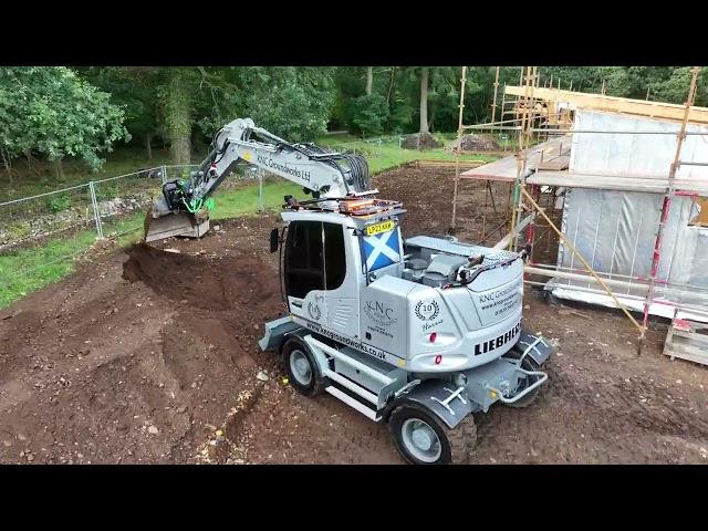 Liebherr A914 Compact on a housing site