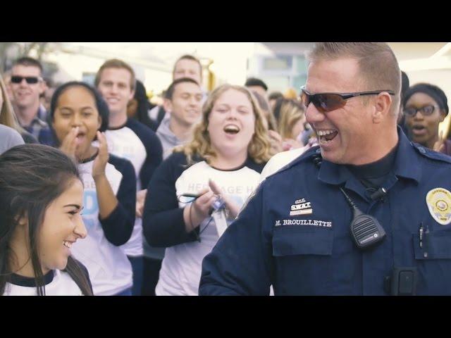 Massive mob overwhelms school's favorite police officer!