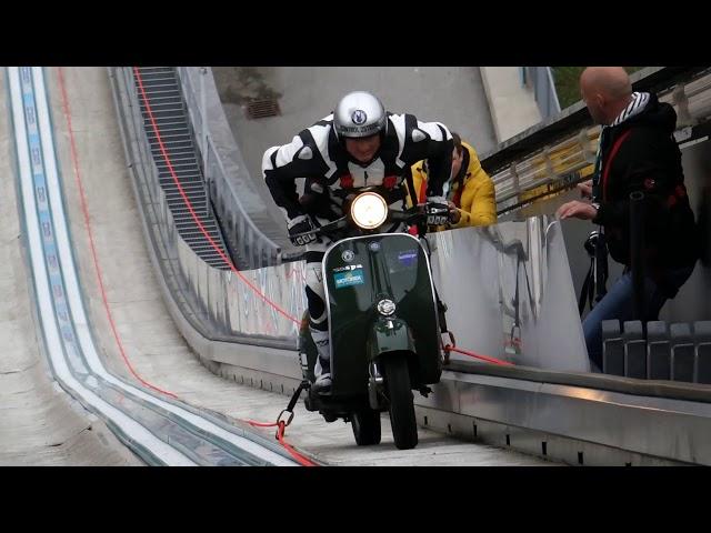 Scooter stuntman hill climbing with Vespa Guenter Schachermayr