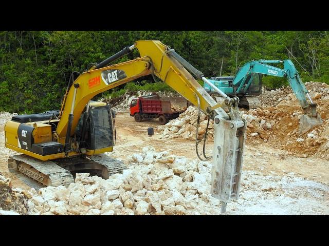 Excavator Dump Trucks Excavating Limestone Road Through The Hills