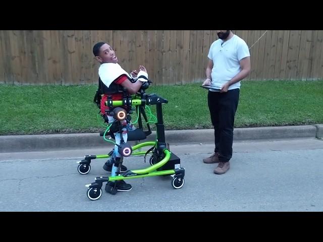 De'Jai enjoys a walk with the Trexo