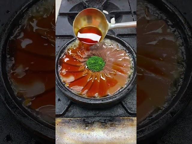 Spicy duck blood, heat the stone pot until golden on one side  Add duck blood and stock sauce, add b