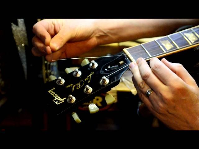 Restring a Guitar by Bill Baker filmed in HD closeup demo on MISFITS guitar Pt. 2