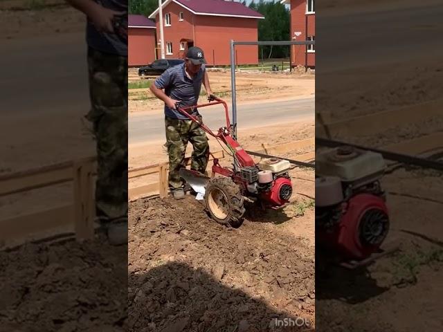 plowing the land with a mini tractor