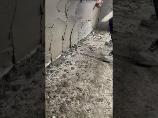 getting the sand and cement render on the concrete block walls