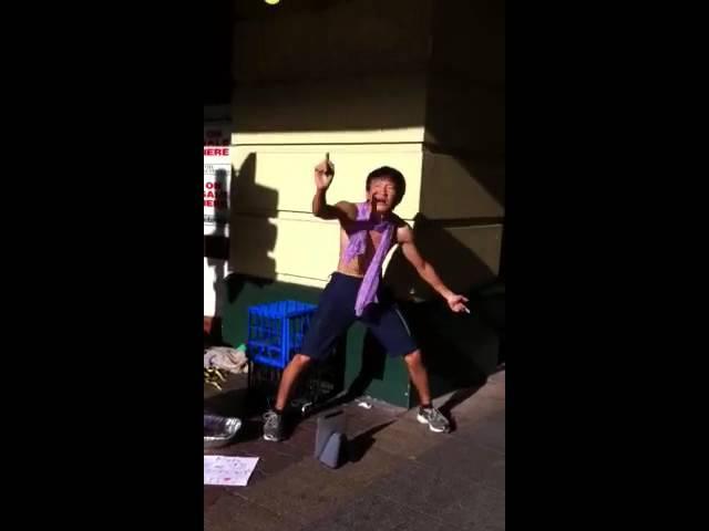 CRAZY ASIAN GUY PLAYING AIR GUITAR IN THE STREET