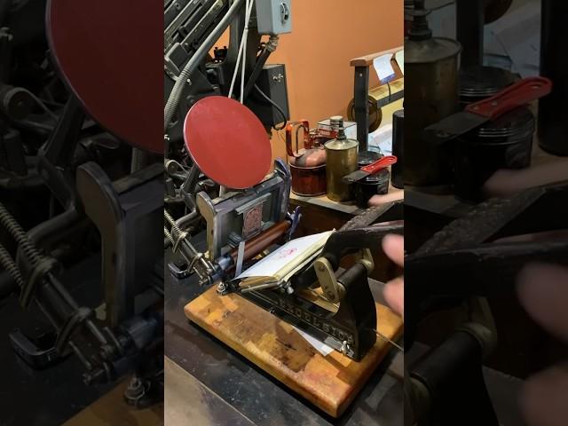 Letterpress printing red prints of Santa Claus