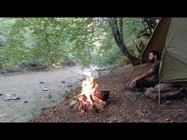 Bushcraft Summer Camping With Stone Fire Place Next To A Roaring River In The Forest