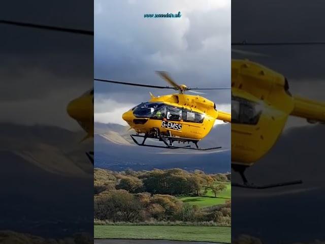 Air Ambulance (G-EMSS), lifting off from Ysbyty Gwynedd Hospital, Bangor, North Wales.