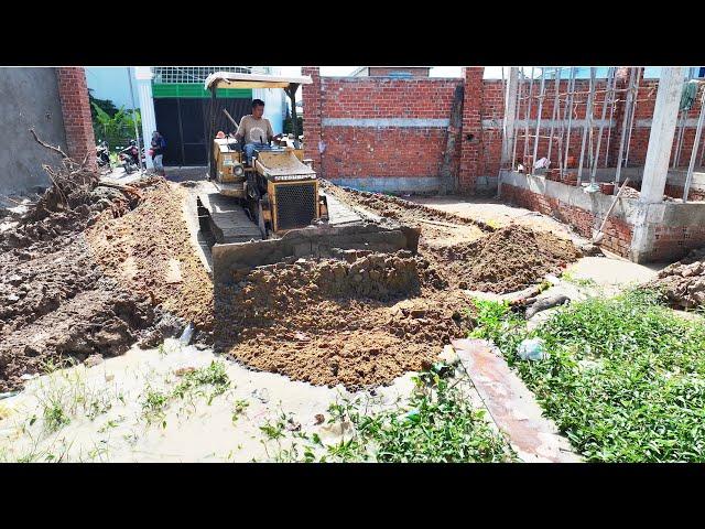 Start new project by Bulldozer MITSUBISHI project, push sand into the ground to build a house Villa.