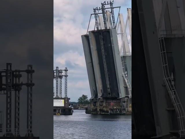 Raising a railway bridge to allow ships to pass in Holland