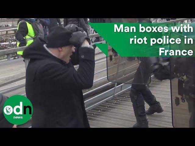 Man boxes with riot police in France