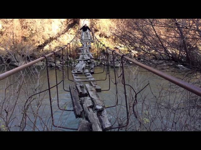 Rickety bridge in abandoned former soviet union area of old Armenia