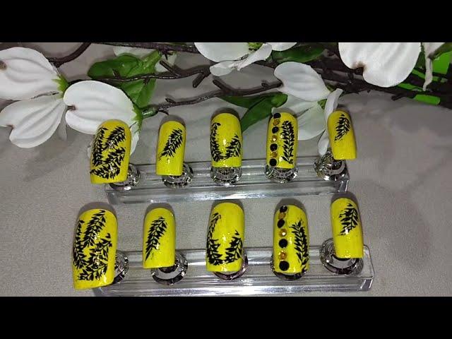 Yellow Black Forest Nail Design