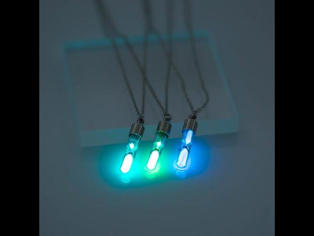 An hourglass necklace glows in the dark