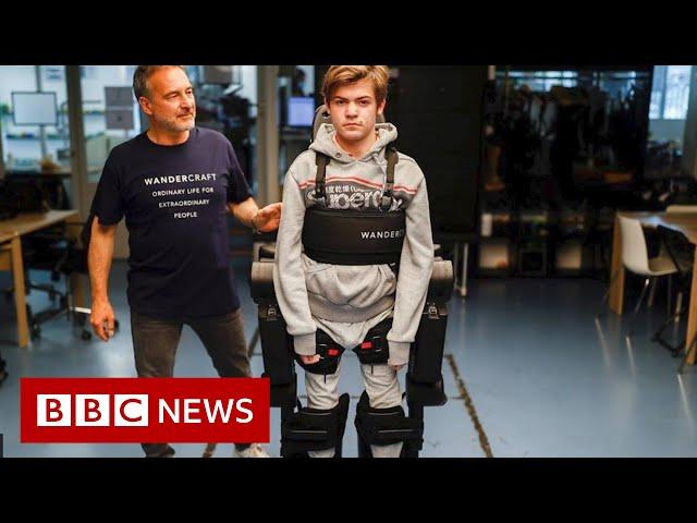 Dad builds robotic exoskeleton to help son walk - BBC News