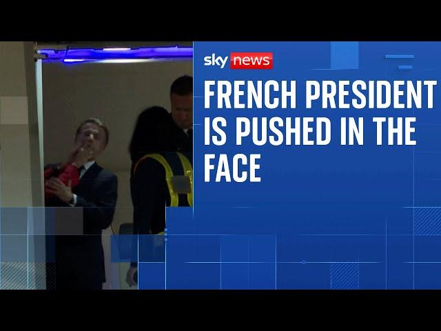 President Macron's wife appears to push him in the face