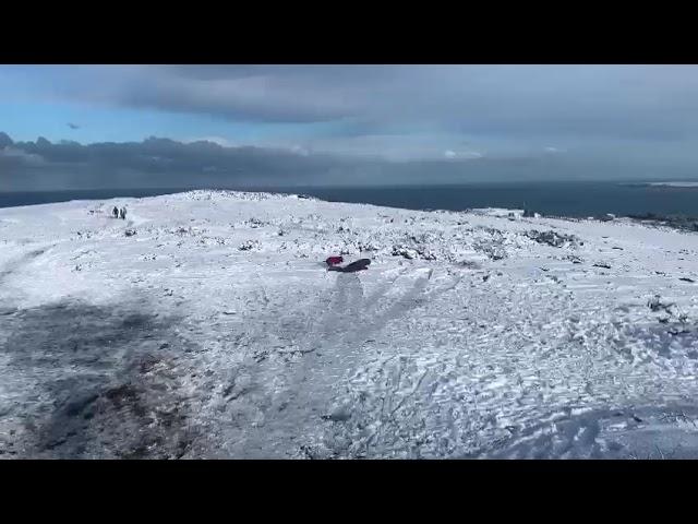 Paul snowbody boarding on St.Agnes Beacon 1. 17.01.2023