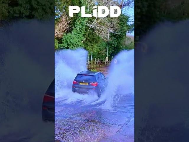 BMW SUV Splashing through Rufford Ford river 