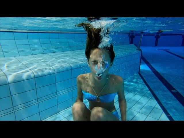 Carla Underwater blowing bubbles underwater