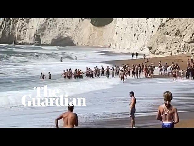 Human chain rescues man struggling in sea at Durdle Door