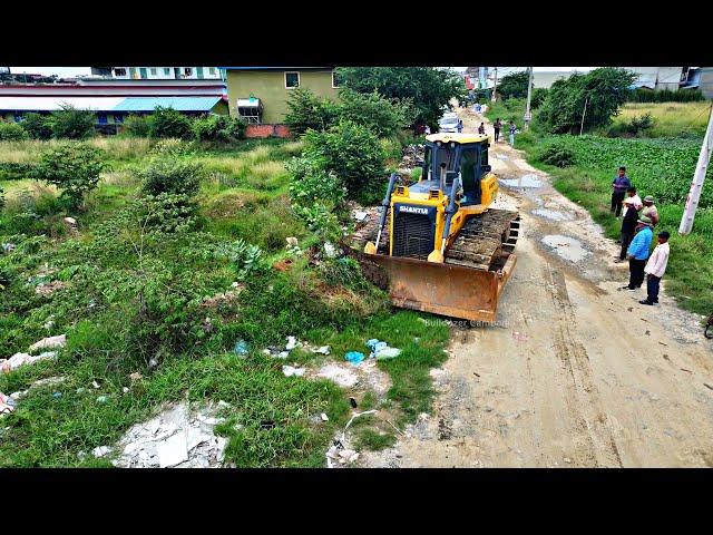 WONDERFUL.OPERATED OF FILLING FLOODED LAND NEXT TO THE ROADS USE SHANTUI DOZER AND SMALL DUMP TRUCKS