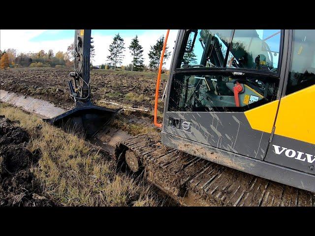 Digging A Ditch In A Large Pond