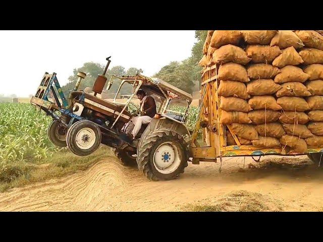 Ford Tractor stunt | Ford Tractor spend full power pulling loaded Trolley | powerful Ford Tractor