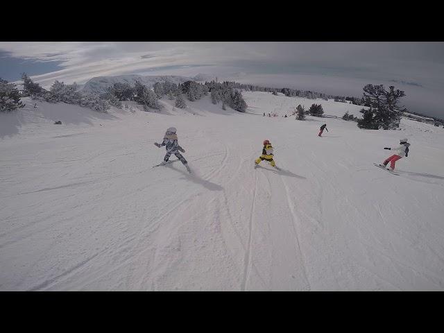 Five years old Vincent & eight yeras old Luizka skiing in France. February 2018