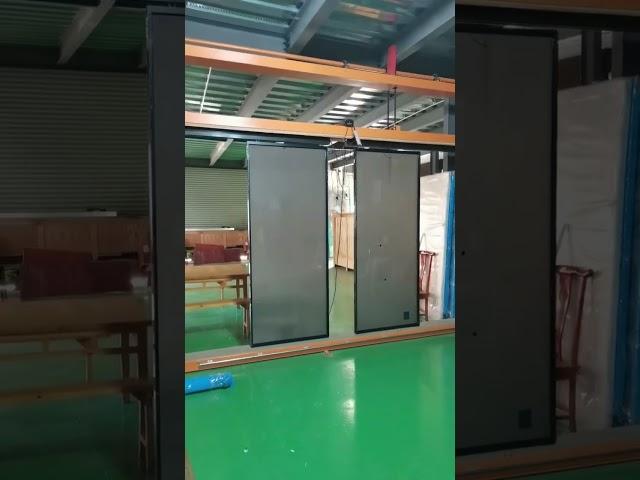 Switchable glass doors, remote control the color of the glass. Electric sliding door opener.