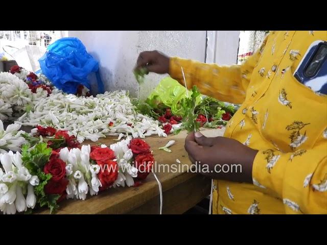 Flower Market in Bangalore, with garlands being made: Come here for Tuberose garlands, marigold, etc