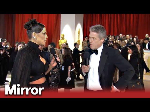 Awkward Hugh Grant interview at Oscars 2023