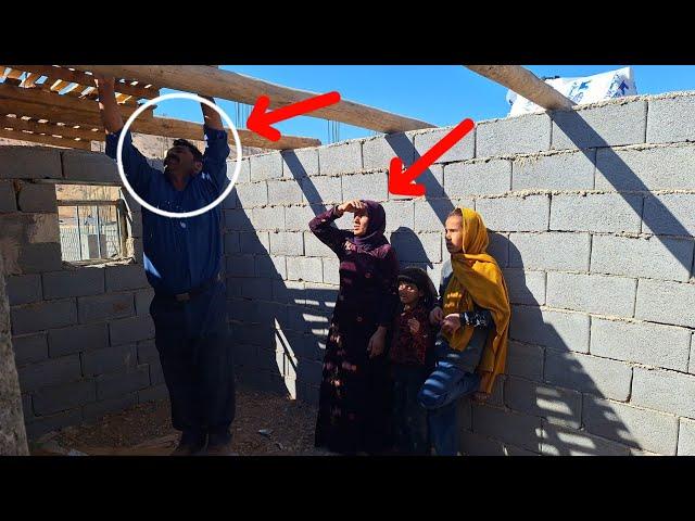 Family project:joint effort mother and her daughters building kitchen ceiling with help master