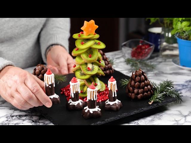 Elegant Edible Table Decorations for Your Next Celebration: Christmas Tree, Pine Cones, and Candles.