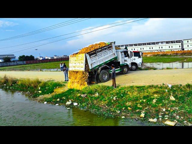 Starting Project Pour Soil Enter Water Will push Land by experts Bulldozer With the group Dump Truck