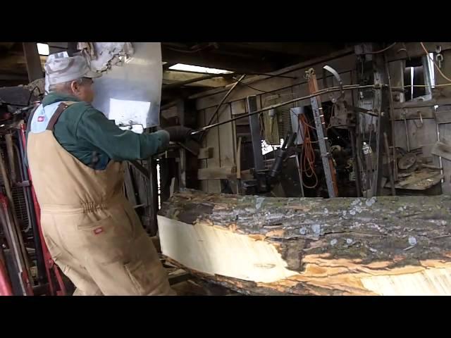 Virgil Storm and his grandson work the sawmill