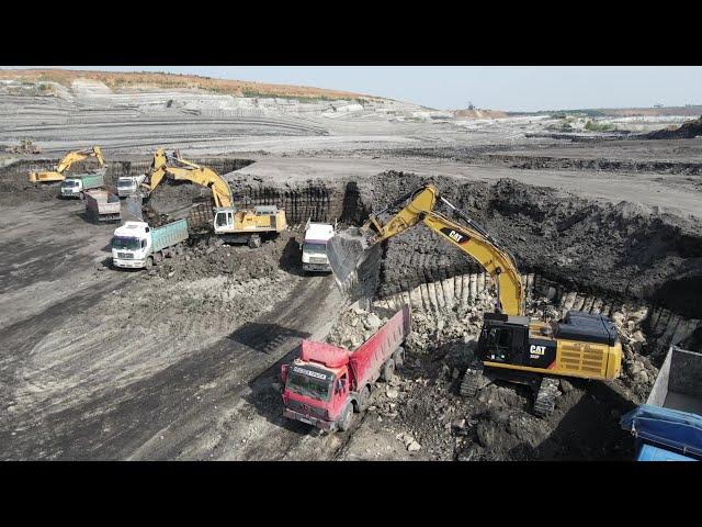 Four Liebherr & Caterpillar 974, 964 And 352F Working On A Huge Mine - Aerial View - Ascon Ltd