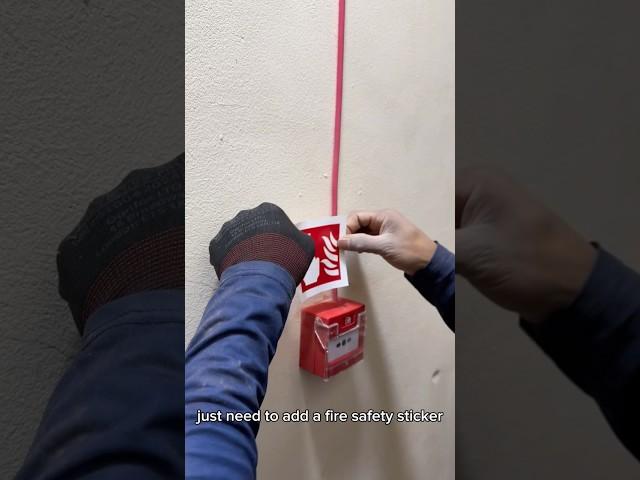 Installing ESP call point with fire safety sticker