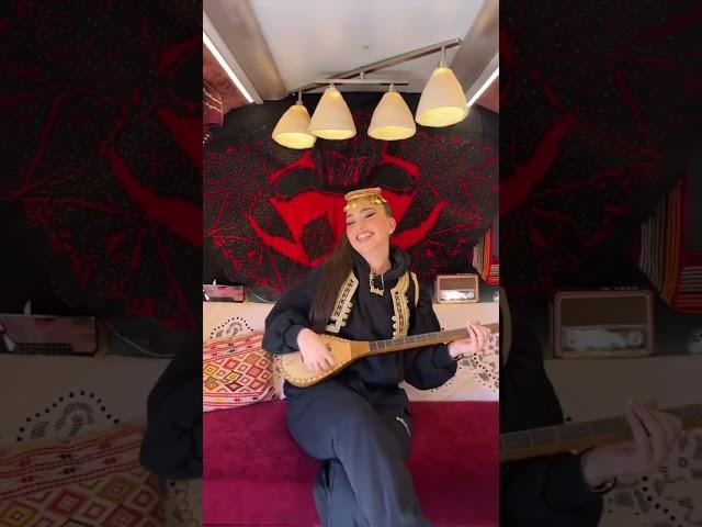 Enisa playing the traditional Albanian Instrument Çifteli 