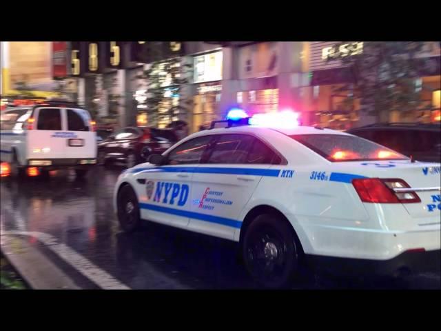 NYPD CRUISER RESPONDING URGENTLY WITH SOME RUMBLER SIREN ON BROADWAY IN TIMES SQUARE, NYC.