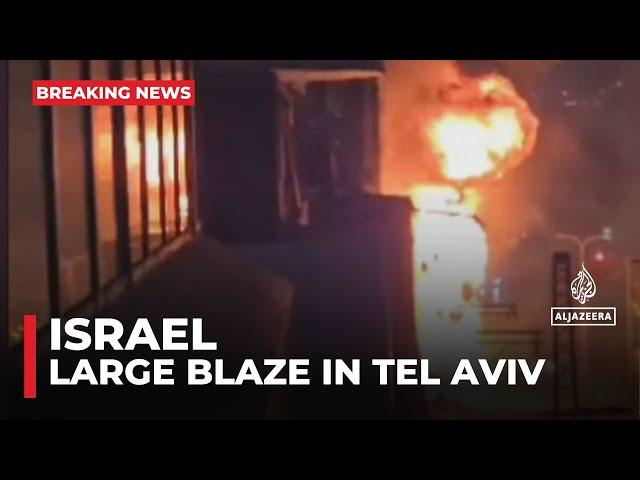 Large blaze in Tel Aviv after raid sirens sound