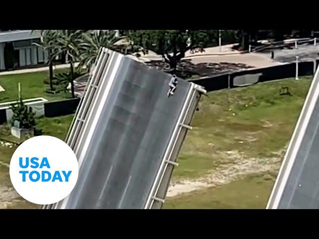 Man scales Florida drawbridge as onlookers watch the terrifying stunt | USA TODAY