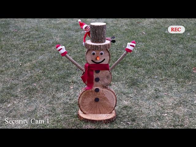 Amazing log snowman made from scratch. Bonus: sneaky elf