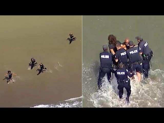 BEACH PURSUIT: Police officers chase man on foot in waves at Venice Beach | ABC7