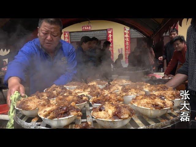 The wedding banquet in the mountains in the countryside, the large iron pot with open firewood